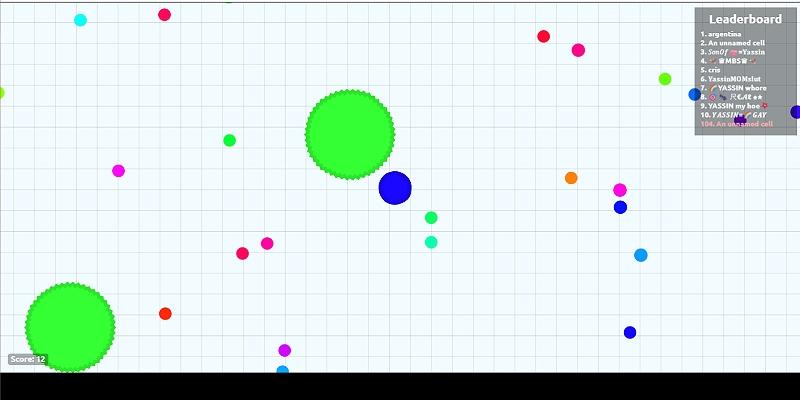  Agar.io with the player's cell surrounded by smaller cells, pellets and a green spiked virus