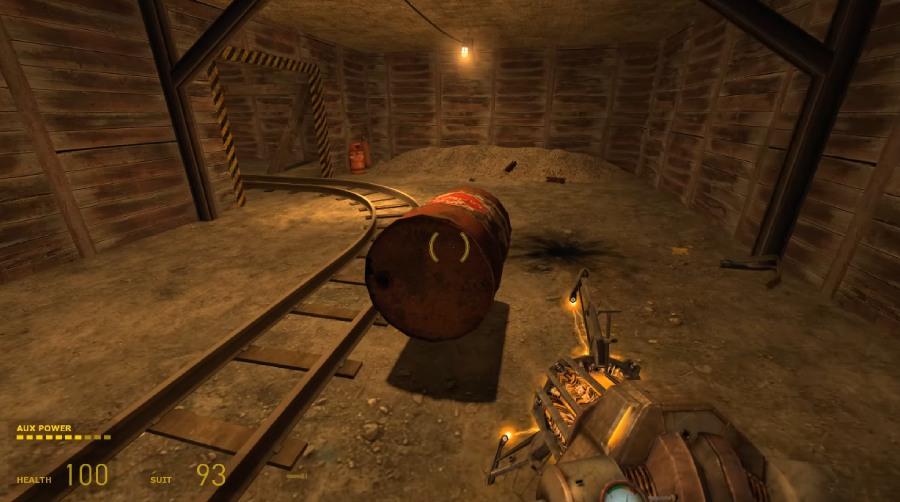 screenshot of Half-Life 2 gameplay, showing the Gravity Gun holding an object in City 17