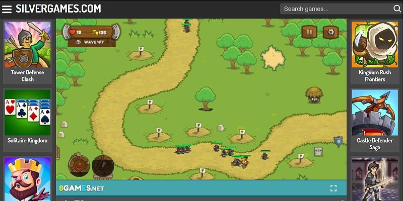 Screenshot of Kingdom Rush on Silvergames: towers along the road with a wave of enemies, Rain of Fire/Reinforcements buttons visible