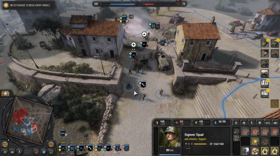 Screenshot of a Company of Heroes 3 battle: infantry squads in cover with a tank nearby, in an Italian village map